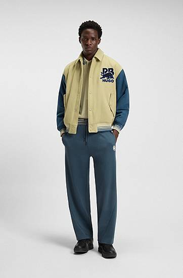 Trenirka BOSS HUGO x RB Oversized-Fit Tracksuit Bottoms with Striped Waistband and Drawstring Mornarica | 50549308, 1