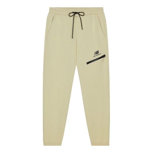Trenirka New Balance Print Sweatpants Bež | AMP13356-BEI