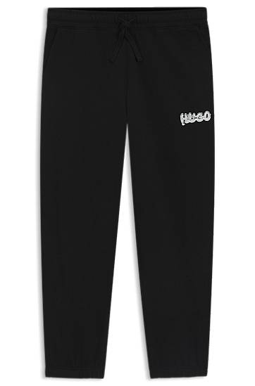 Trenirka BOSS Cotton-terry tracksuit bottoms with logo print Črna | 50549779