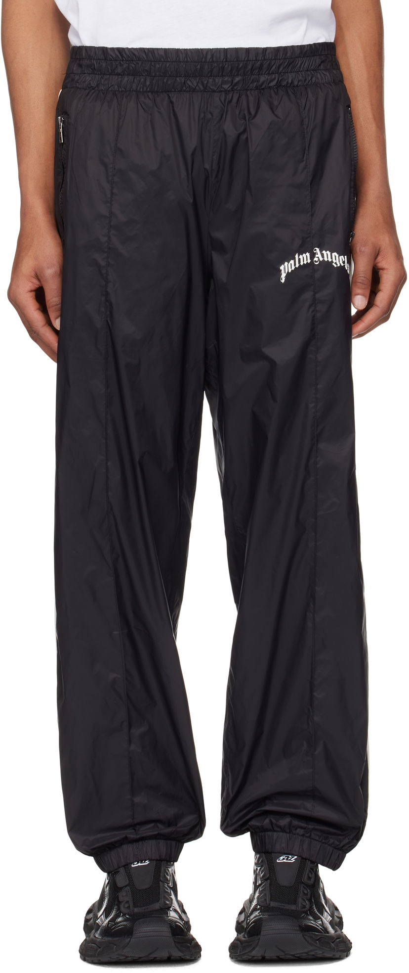 Trenirka Palm Angels Palm Angels Curved Logo Nylon Track Pants Črna | PMCA179S25FAB0011009