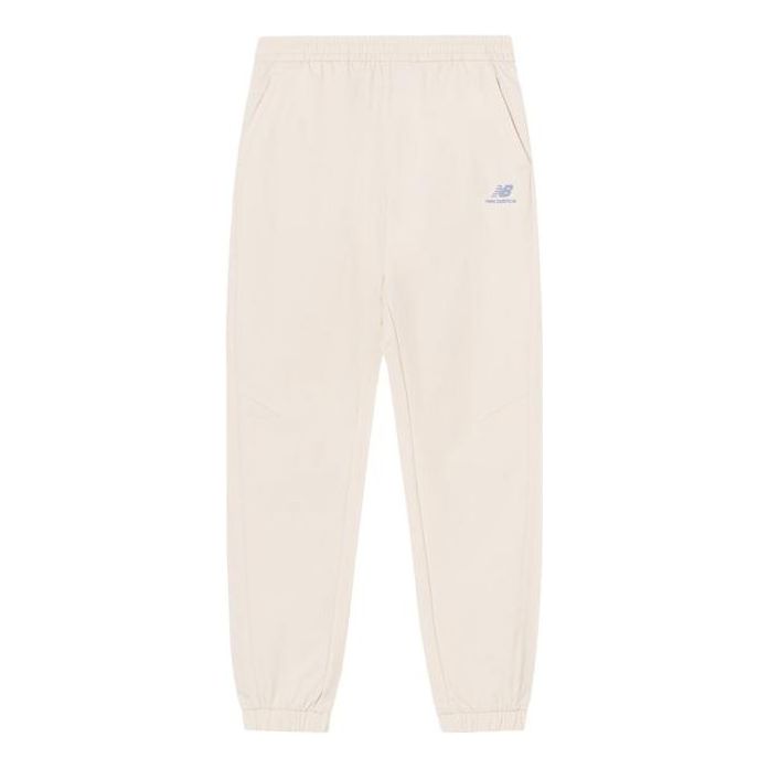 Trenirka New Balance Sportswear Logo Pants Bež | 5TC44572-IV