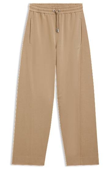 Trenirka BOSS Stretch Jersey Balloon Trousers with Embroidered Logo Bež | 50547800