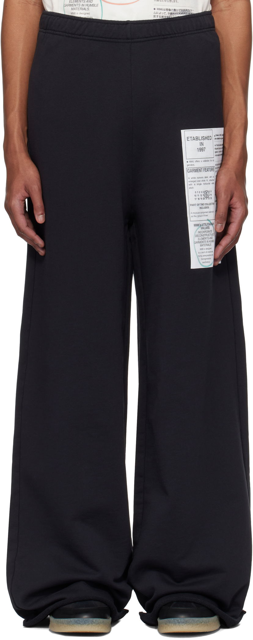 Trenirka Maison Margiela MM6 Maison Margiela Newspaper Print Sweatpants Črna | SH0KA0013 M25012