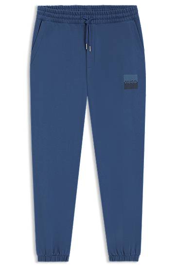 Trenirka BOSS HUGO Cotton-Terry Tracksuit Bottoms with Split Logo Modra | 50542866