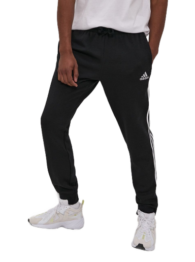 Hlače in kavbojke adidas Performance Essentials French Terry Tapered Cuff 3 Stripes Črna | GK8821
