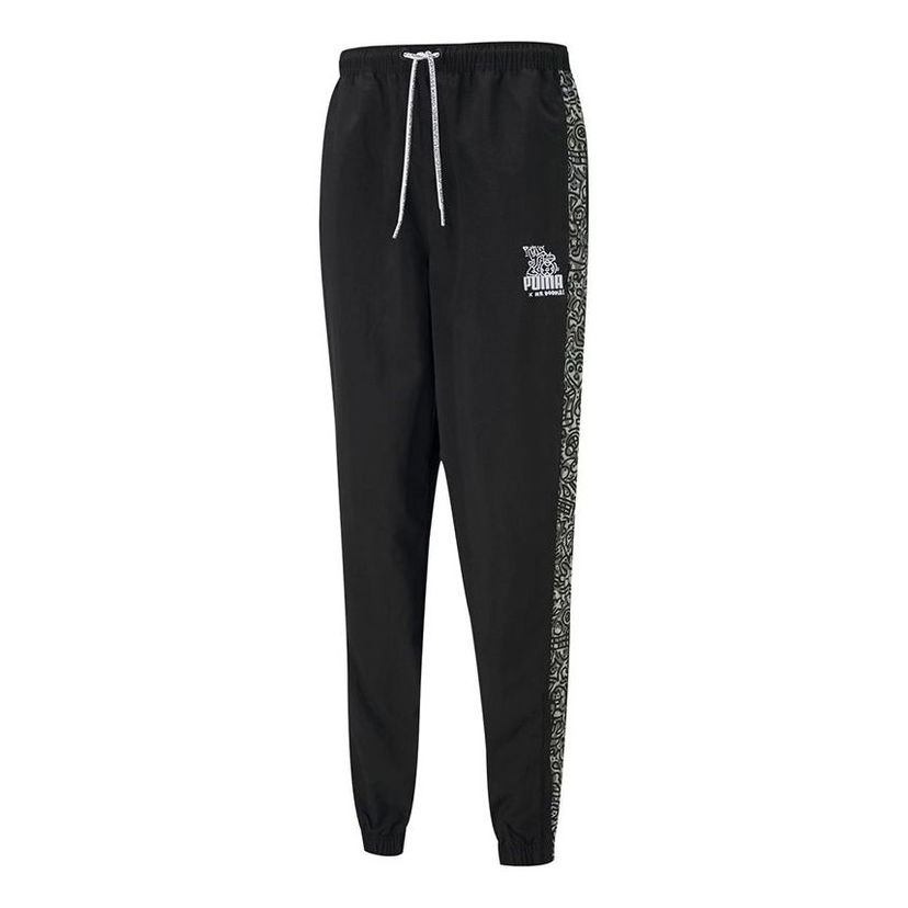 Trenirka Puma Mr Doodle Crossover Drawstring Woven Pants Črna | 598684-01