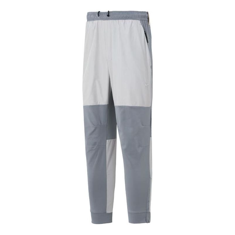 Hlače Nike Unlimited Water-Repellent Zippered Cuff Pants Siva | FB8602-084